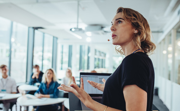 A woman is giving a presentation.
