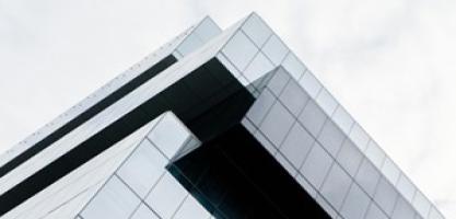 The top corner of a building, in looked up angle.