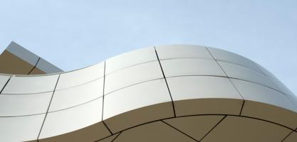 A wave shaped facade of a building.